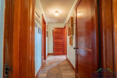 Corridor featuring light hardwood / wood-style flo