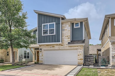 View of front of house with concrete driveway, st