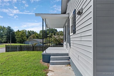 View of side of home with a lawn