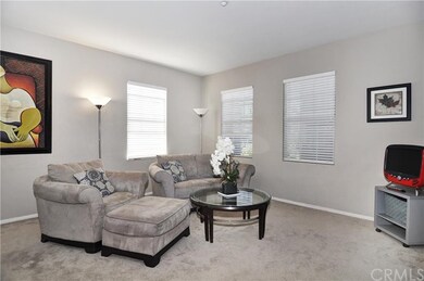 Open floor plan living room features entertainment