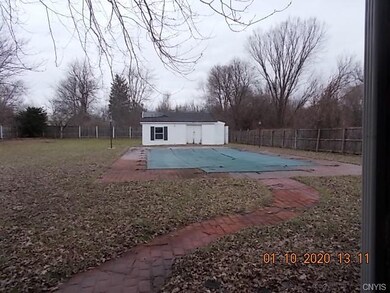 in ground pool and storage  pool shed