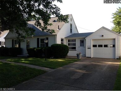 front view with attached garage and all season sun