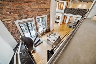 This photo showcases a modern, open-concept loft w
