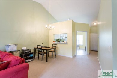 living room, hallway looking into kitchen