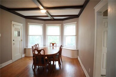 Formal dining room with beautiful bay windows