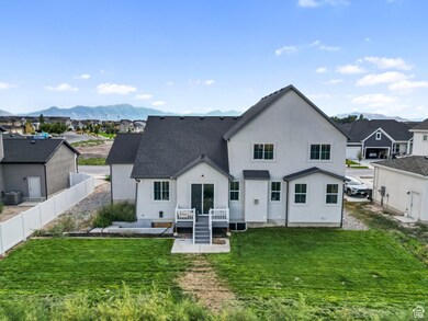 Back of property featuring a residential view, stucco siding, a patio, roof with shingles, and a mountain view