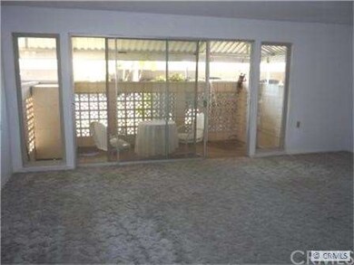 Living room showing covered patio of living room