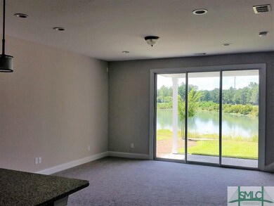 FAMILY ROOM/COVERED PORCH OVERLOOKING PRIVATE LAGO