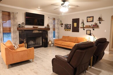 Living room with light wood-type flooring, ceiling
