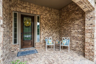 This home features a spacious covered porch, the p