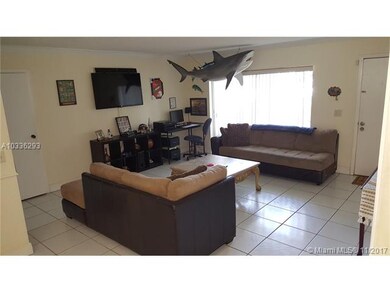 Large 16.5' x 14.5' tiled Living room with sliding