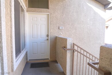 Doorway to property with stucco siding and a balco