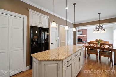 Upgraded Kitchen Island with granite and pendant l