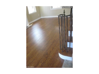 Gleaming hardwood floors in the living and dining 