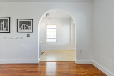 View from living area into dining/kitchen area