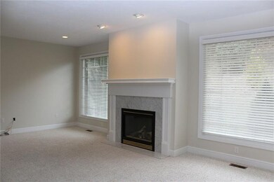 Family Room with large windows and fireplace