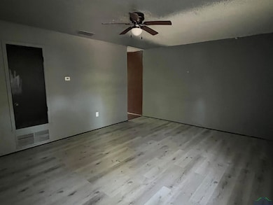 Spare room with ceiling fan and wood finished floors