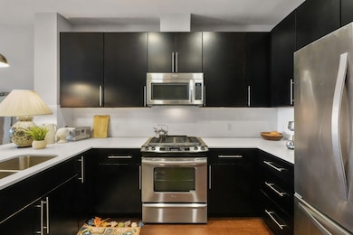 Kitchen featuring appliances with stainless steel