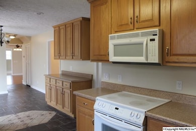 With Oak Cabinets and Tile Floor