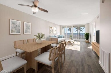 Dining space with dark wood-style flooring, a ceiling fan, and baseboards