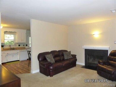 Living Room - 15 x 11.5 - Carpet, Fireplace