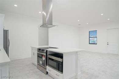 Kitchen featuring appliances with stainless steel