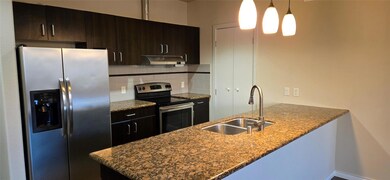 Kitchen featuring tasteful backsplash, appliances 