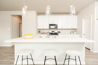 A massive granite island takes center stage, compl