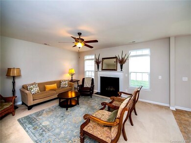 Large and open family room with 2 inch wooden blin