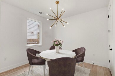 Dining room with a chandelier, light wood-type fl