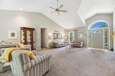 Great room with vaulted ceiling greets you upon en