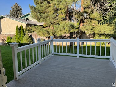 Wooden deck featuring a fenced backyard