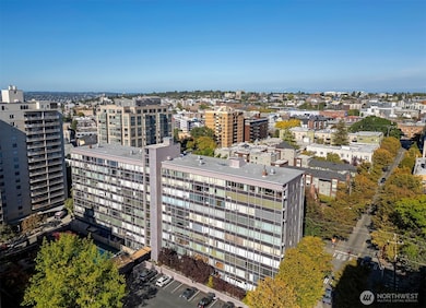 The West-facing 4th floor condo has unobstructed downtown Seattle views while feeling close to the tree-lined street.