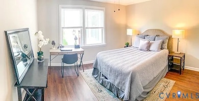 Bedroom with wood finished floors and ceiling fan