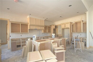 Large island with breakfast bar, double ovens, wal