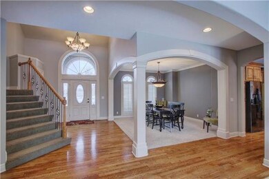 Beautiful two story entry way with gleaming hardwo