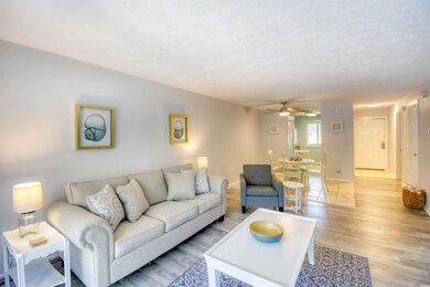 Living room featuring a textured ceiling, ceiling 