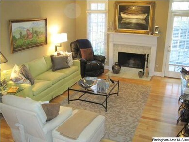 Spacious family room with marble fireplace. Opens 