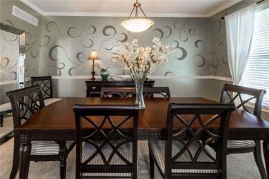 The formal dining room offers sophisticated wall t