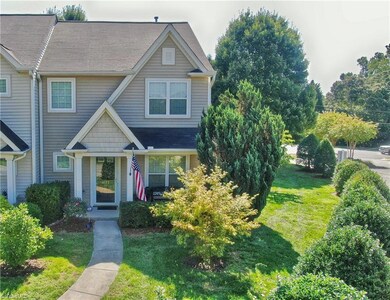Slight aerial view shows more of the landscaping...such a perk with this home!