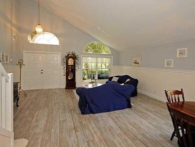 Exterior Front. Alook from the upstairs loft at the living and dining room.   Very clean and open look.