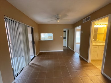 Dining room with bathroom and bedroom to the right
