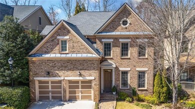 View of front of home with brick siding, concrete 