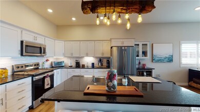 HUGE kitchen w/tons of storage space and custom ti