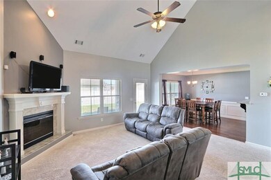 Great Room boasts cathedral ceilings and open conc