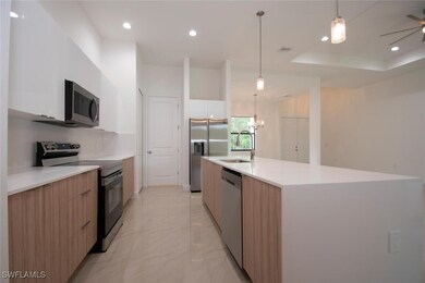 Kitchen with white cabinetry, stainless steel appl