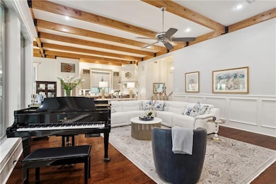 Notice the TRUE wood beams crowning the living spa