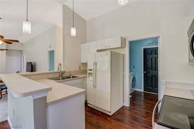Kitchen with entrance to laundry room and garage