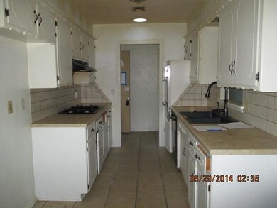 View of kitchen from dining area. Features ceramic
