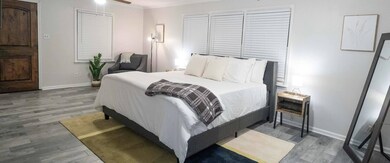 Bedroom with crown molding, hardwood / wood-style 